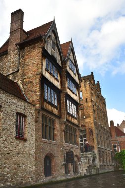 Bruges, Belgium - 29th April 19:An old building on the canal waterfront in the city of Bruges
