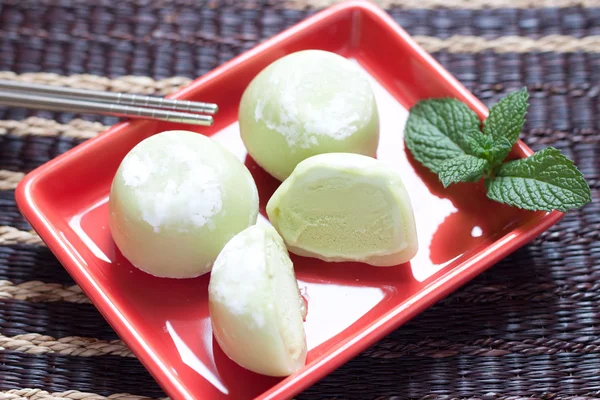 Green tea mochi ice cream on red plate — Stock Photo, Image