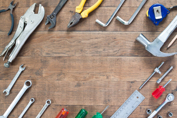 Technician tools on wood background with copy space
