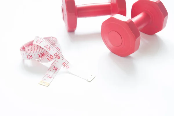 Measuring tape with red dumbbells isolated on white background w — Stock Photo, Image