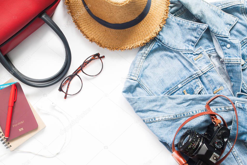 Flat lay of woman traveler items and passport on white backgroun