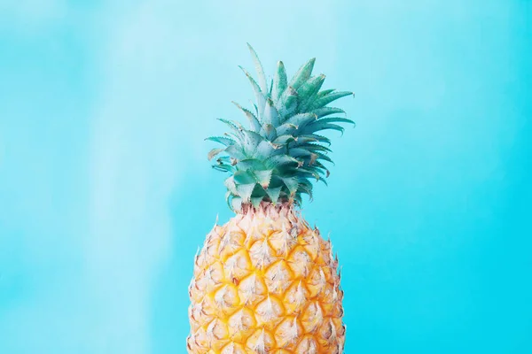 Pineapple on turquoise color background, Fashion and Creative concept