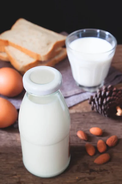 Almond milk bottle, sliced bread and boiled eggs, Healthy dairy products