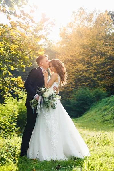 Elegant curly bride and stylish groom — Stock Photo, Image