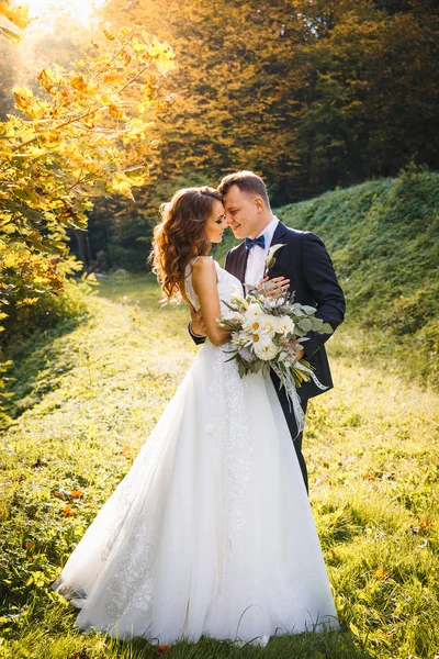 Elegant curly bride and stylish groom — Stock Photo, Image