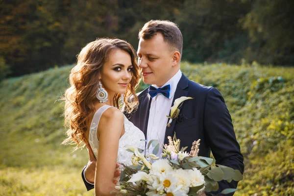 Elegant curly bride and stylish groom — Stock Photo, Image