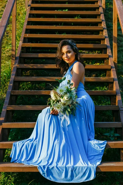 Beautiful young bridesmaid with curly hair — Stock Photo, Image