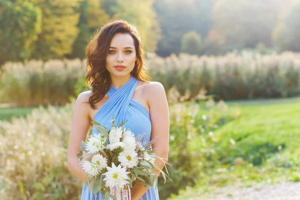 Beautiful young bridesmaid with curly hair — Stock Photo, Image