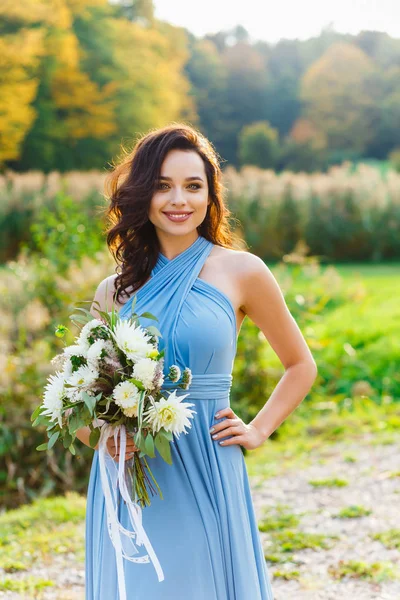 Beautiful young bridesmaid with curly hair — Stock Photo, Image