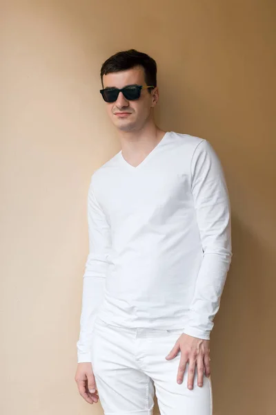 A young man in white wear — Stock Photo, Image