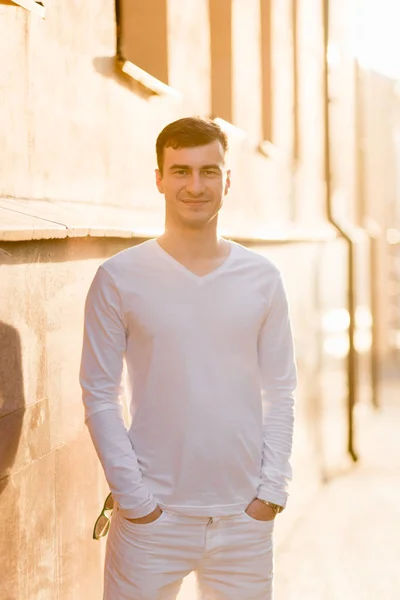 A young man in white wear — Stock Photo, Image