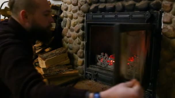 Man Puts Wood Firebox Fireplace His Country House — Stock Video