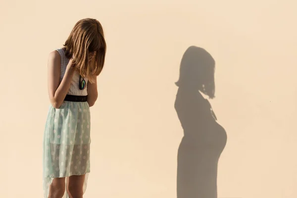 A girl cries after learning about an unwanted pregnancy.