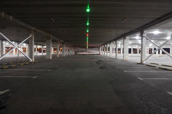 Empty car Parking in the shopping center during pandemic. People avoid public places and stay at home. The concept of pandemic, epidemic, covid-19.