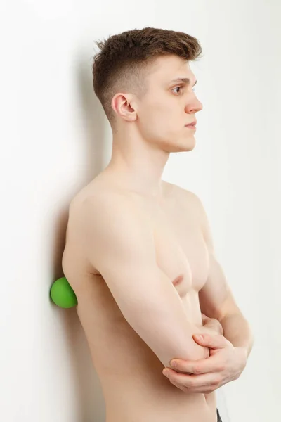 Handsome Man Shows Exercises Using Wall Ball Myofascial Release Massage — Stock Photo, Image