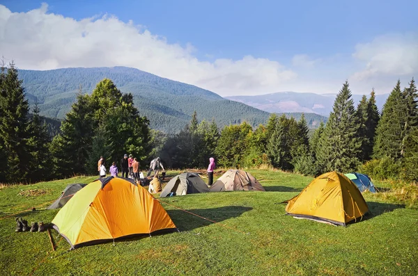 Mountain landscape at sunshine. Tourist tents in forest , Carpathian ,Ukraine — Stock Photo, Image