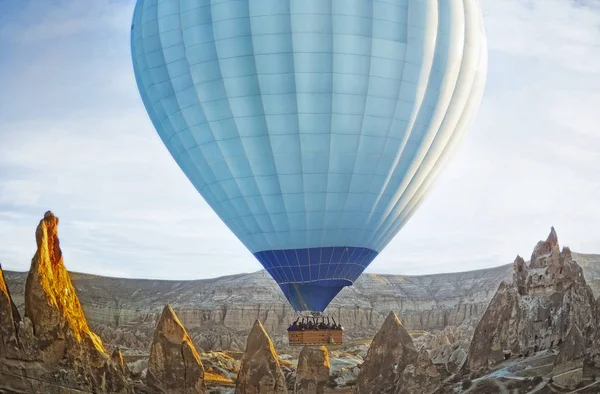 Colorful hot air balloon flying over the valley at Cappadocia Stock Picture