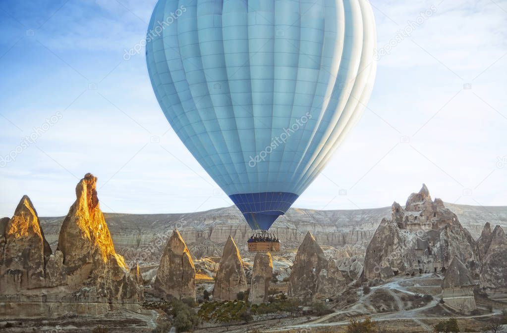 Colorful hot air balloon flying over the valley at Cappadocia