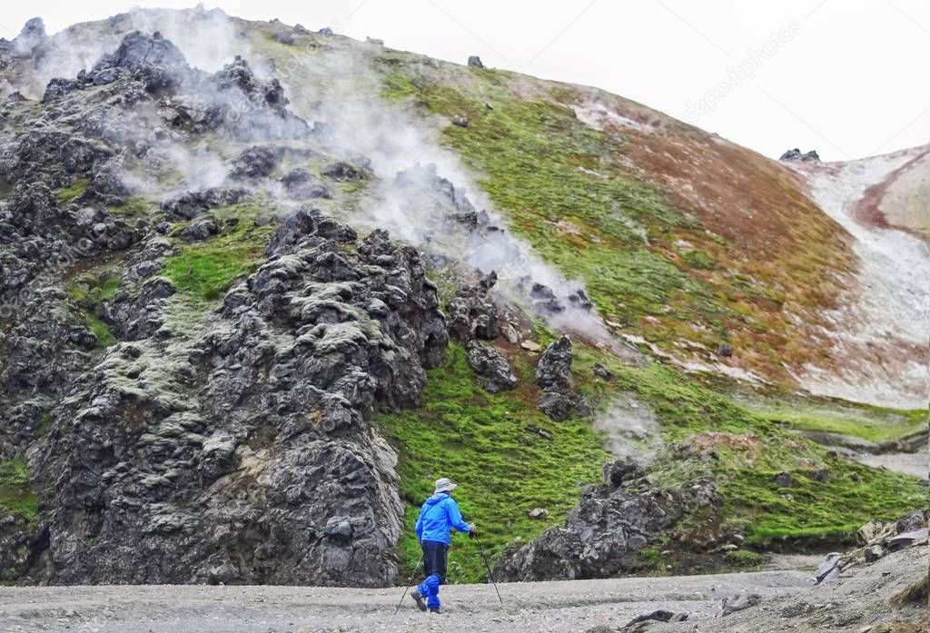 Man hiker walking in mountain landscape, Iceland 