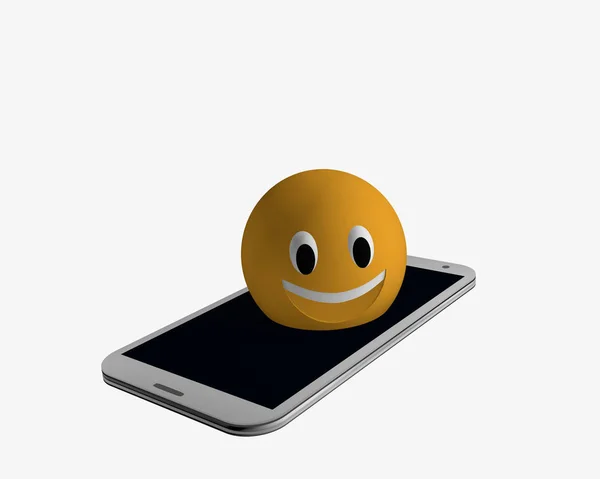 Emoticon sale de un teléfono celular . — Foto de Stock