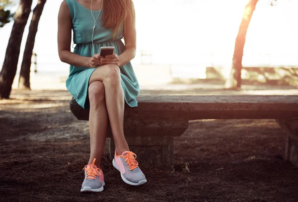 Woman with smartphone outdoors — Stock Photo, Image