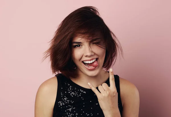 Emotional woman over pink background — Stock Photo, Image