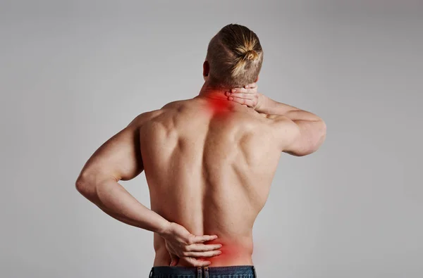 Man with backache — Zdjęcie stockowe
