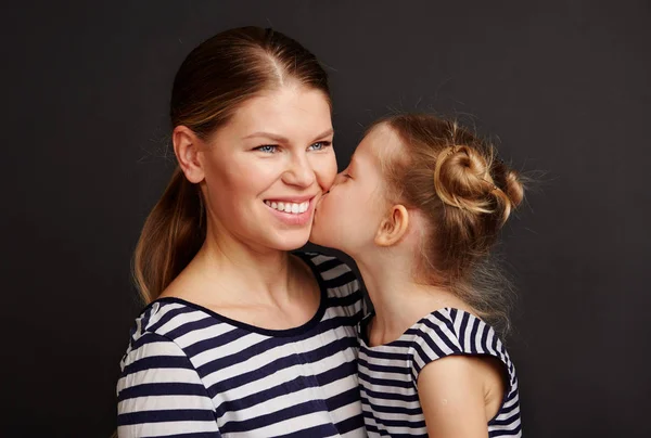 Petty Girl Kissing Her Mother Beautiful Female Smiling Hugging Her — Stock Photo, Image