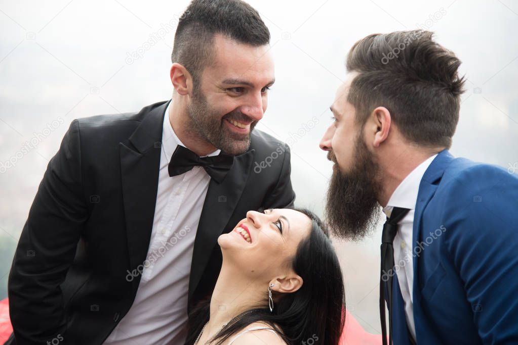 two men and a woman in love triangle, smiling resumed in the foreground