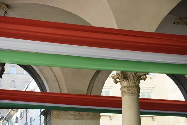 Tricolor flag of the Italian Republic, Brescia, Italy. Palace in Piazza della Loggia, day of the unification of Italy and the armed forces.