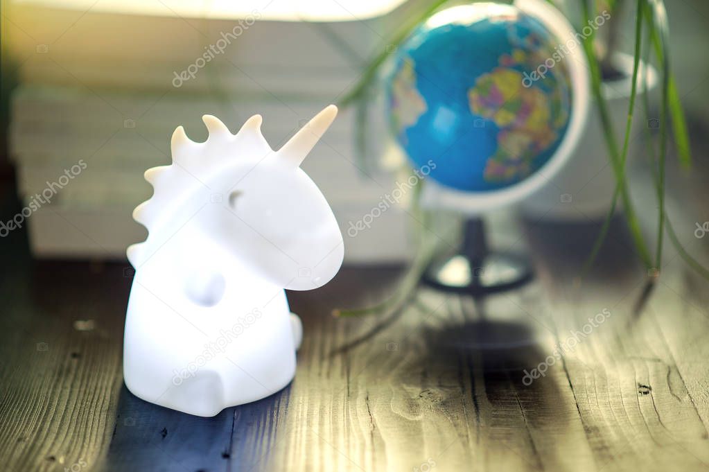Unicorn shape table lamp illuminated