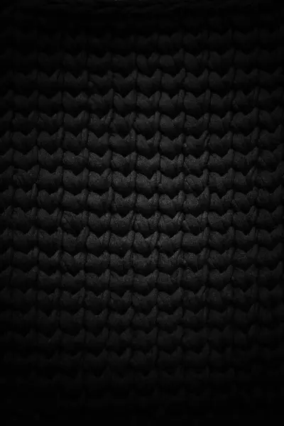 Grunge close-up foto van gebreide zwarte textuur — Stockfoto