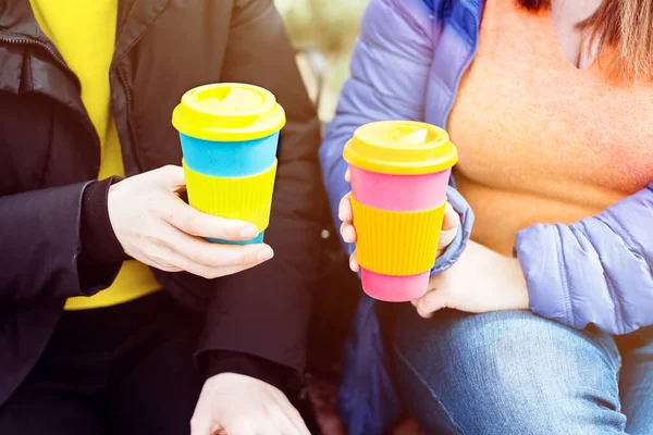 Two women with reusable coffee mug. Zero waste. Sustainable lifestyle concept.