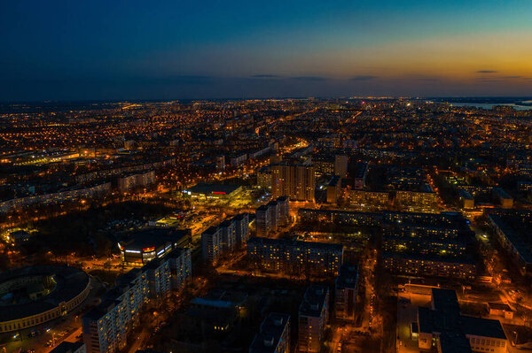 City night aerial view. Cityscape with living houses and commercial buildings
