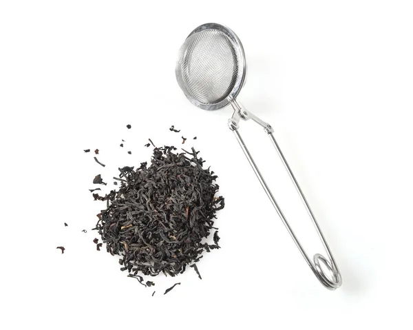 Черный чай и infuser — стоковое фото
