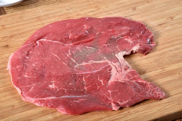 Uncooked Round steak — Stock Photo, Image