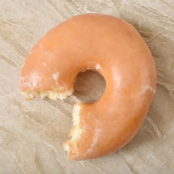 Glazed donut, overhead view — Stock Photo, Image