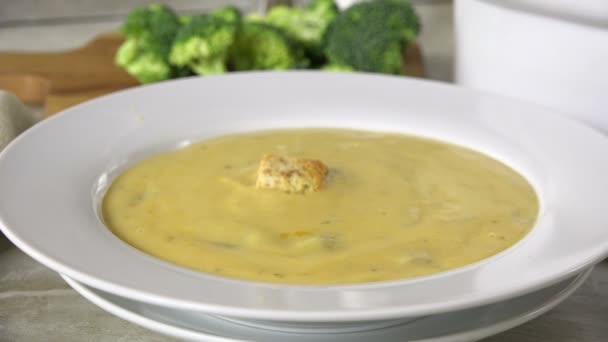 Dropping Croutons Bowl Broccoli Cheese Soup Slow Motion — ストック動画