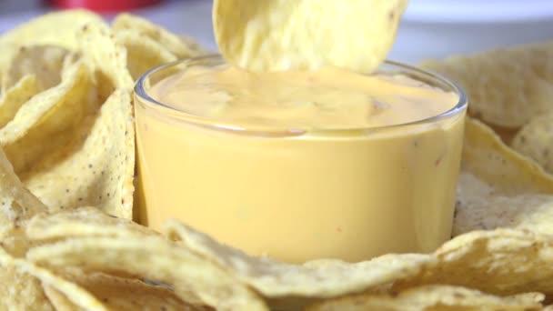 Dipping Tortilla Chip Cheese Sauce Slow Motion — Stock Video