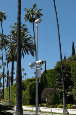 Traffic light cameras at an intersection in Beverly Hills California clipart