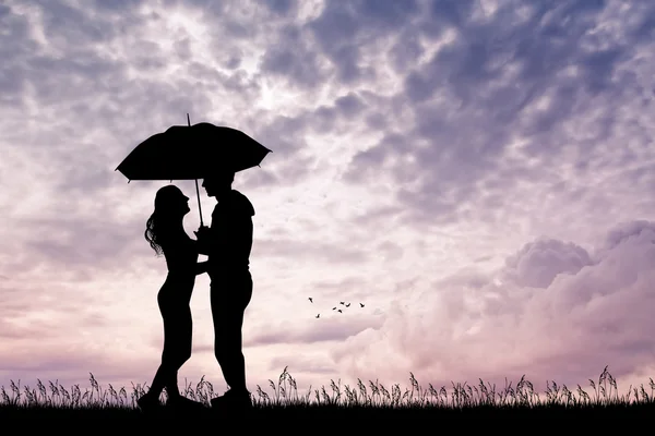 Romantic couple with umbrella at sunset — Stock Photo, Image