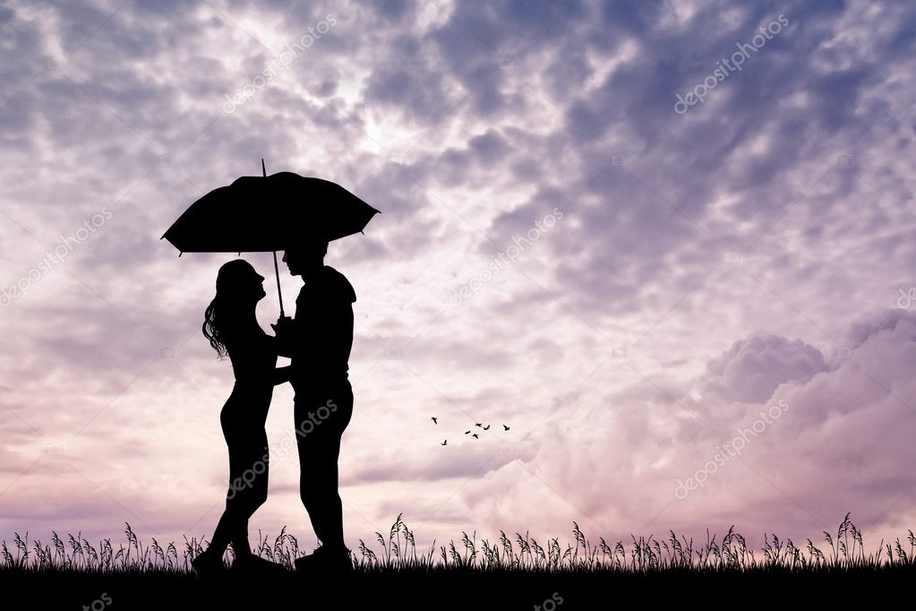 Romantic couple with umbrella at sunset Stock Photo by ©adrenalina
