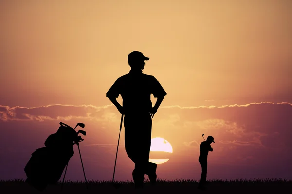 Golfspeler bij zonsondergang — Stockfoto