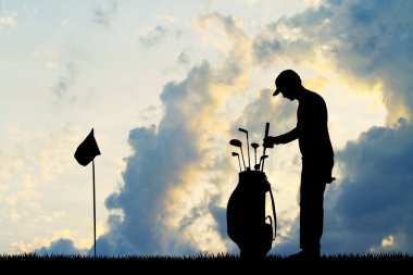 adam golfçü siluet gün batımında