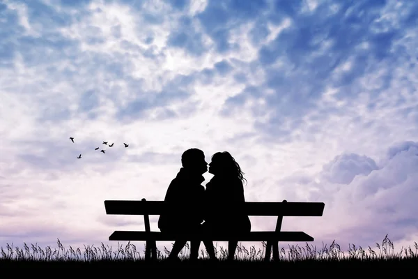 Mann und Mädchen küssen sich bei Sonnenuntergang auf Bank — Stockfoto