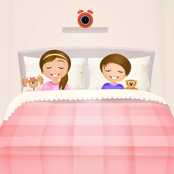 Děti v posteli — Stock fotografie
