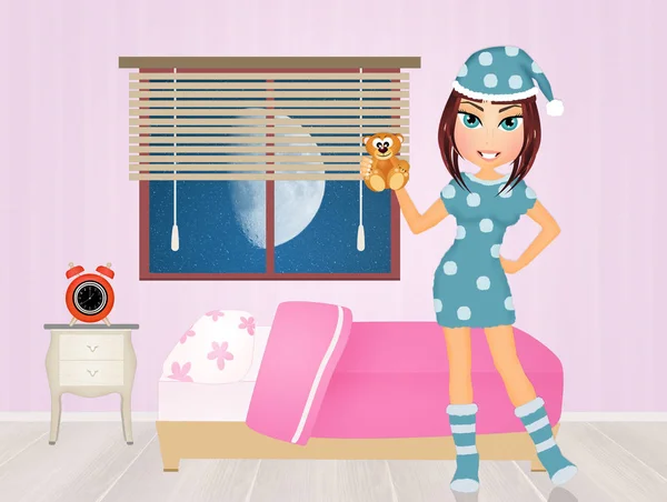 Девушка в пижаме в спальне — стоковое фото