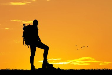 adam dağda günbatımında trekking