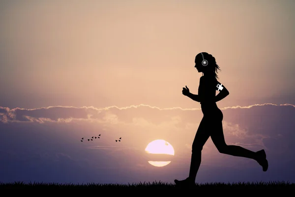 Mujer corre con auriculares para la música —  Fotos de Stock