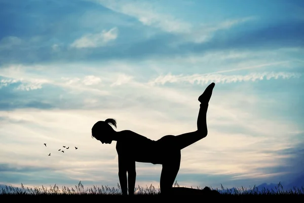 Yoga pose at sunset — Stock Photo, Image